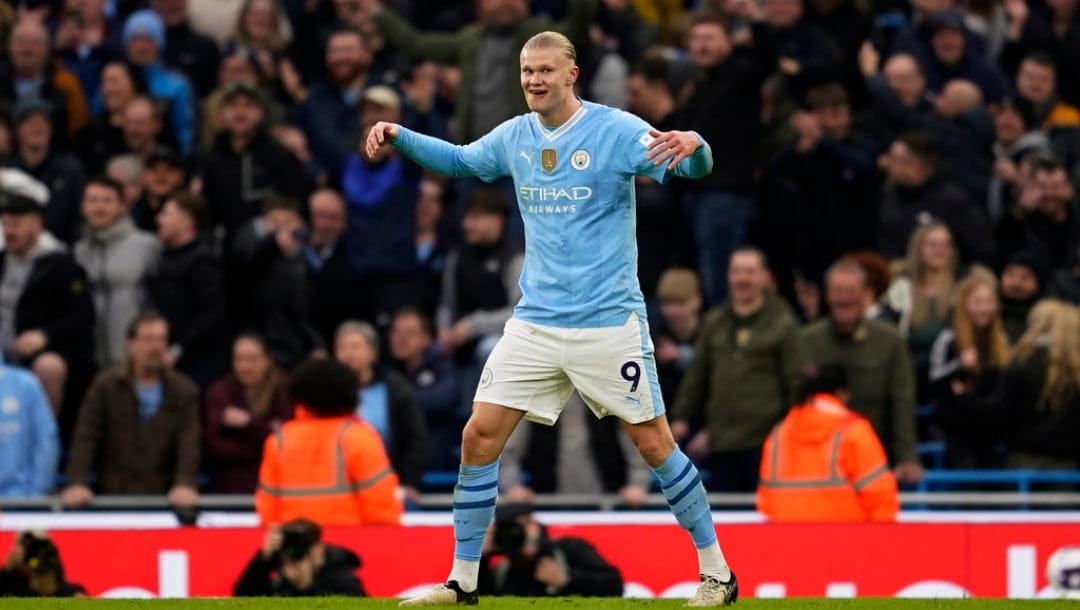 Manchester City's Erling Haaland celebrates after scoring his side's third goal during an English Premier League soccer match between Manchester City and Manchester United at the Etihad Stadium in Manchester, England, Sunday, March 3, 2024.