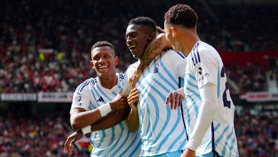 Nottingham Forest's Taiwo Awoniyi, centre, celebrates with teammates after scoring his side's opening goal during the English Premier League soccer match between Manchester United and Nottingham Forest at the Old Trafford stadium in Manchester, England, Saturday, Aug. 26, 2023.