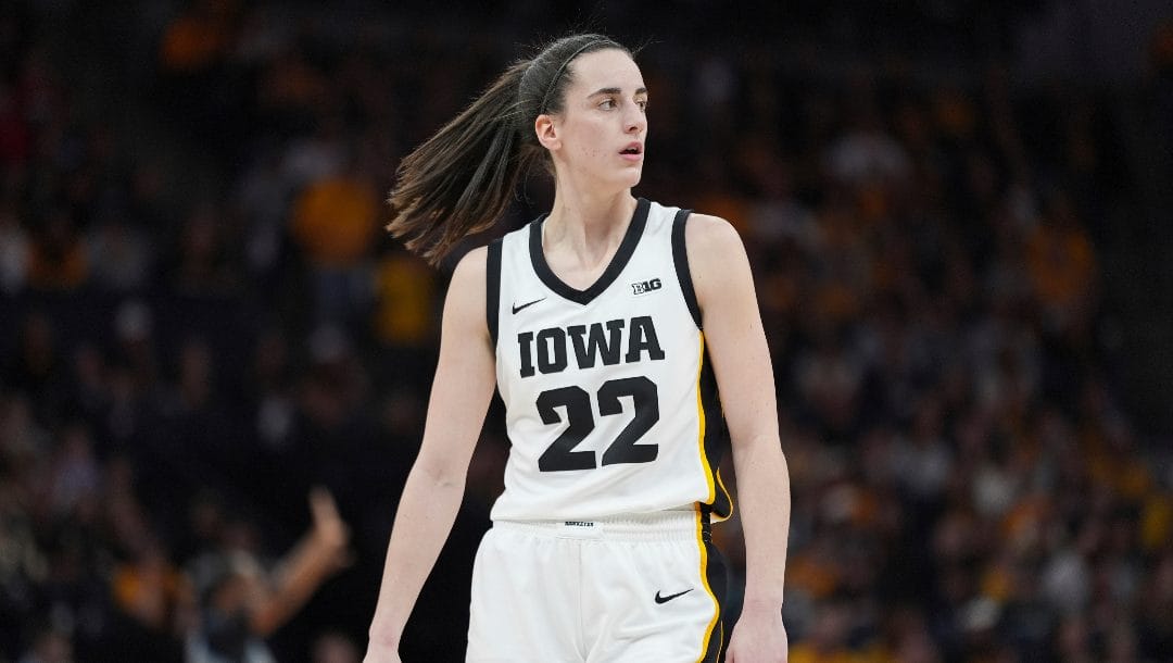 Iowa guard Caitlin Clark (22) stands on the court during the first half of an NCAA college basketball game against Nebraska in the final of the Big Ten women's tournament Sunday, March 10, 2024, in Minneapolis.