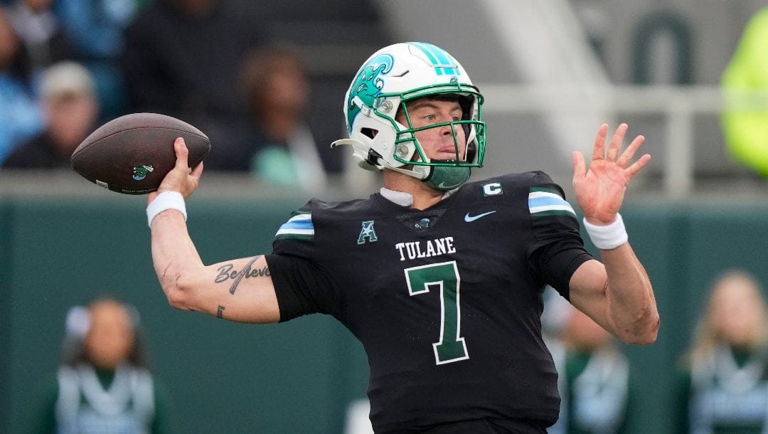 Tulane quarterback Michael Pratt (7) passes in the first half of an NCAA college football game against UTSA in New Orleans, Friday, Nov. 24, 2023.