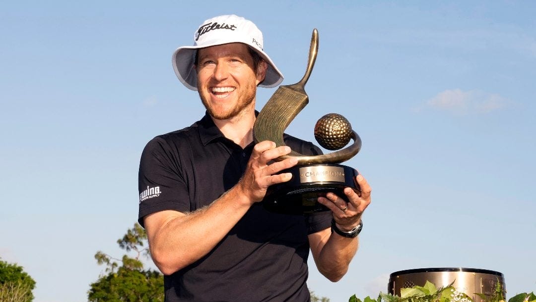 Peter Malnati holds up the trophy after winning the Valspar Championship golf tournament Sunday, March 24, 2024, at Innisbrook in Palm Harbor, Fla.