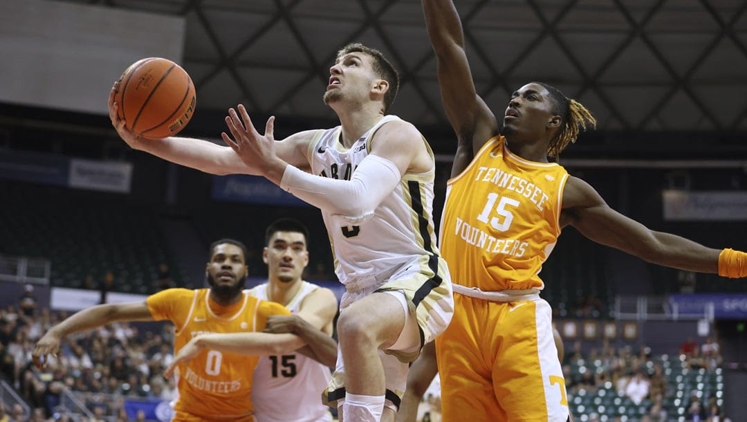 Purdue guard Braden Smith goes to the basket while being guarded by Tennessee guard Jahmai Mashack (15) during the first half of an NCAA college basketball game Tuesday, Nov. 21, 2023, in Honolulu. Smith was selected to the AP All-Big Ten first team in voting released Tuesday, March 12, 2024.