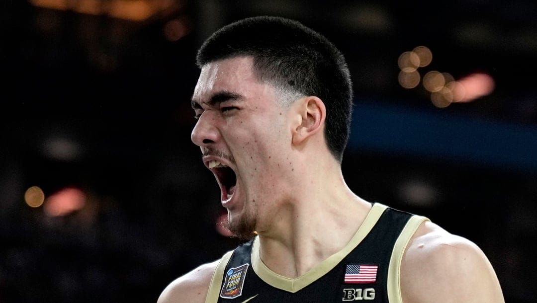 Purdue center Zach Edey celebrates after blocking a shot against UConn during the first half of the NCAA college Final Four championship basketball game, Monday, April 8, 2024, in Glendale, Ariz. (AP Photo/Brynn Anderson)