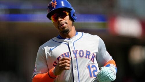 New York Mets' Francisco Lindor scores on a single hit by Francisco Alvarez during the first inning of a baseball game against the Cincinnati Reds Sunday, April 7, 2024, in Cincinnati.