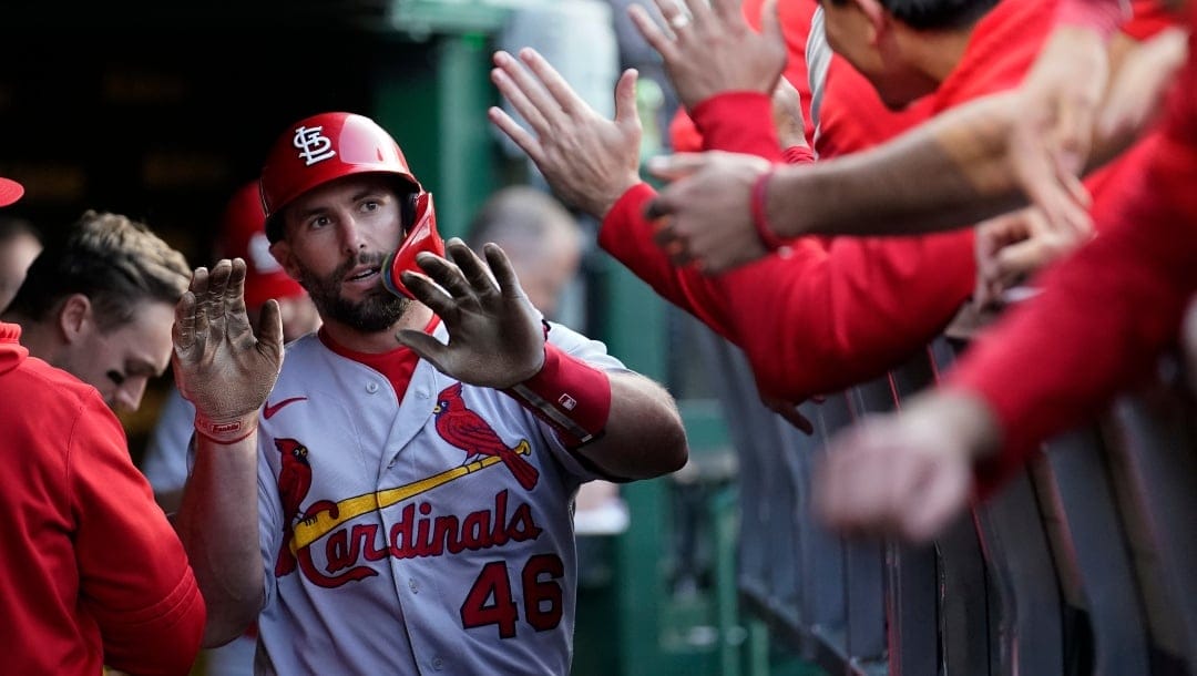 St. Louis Cardinals' Paul Goldschmidt celebrates in the dugout after scoring on a triple by Nolan Arenado off Chicago Cubs starting pitcher Justin Steele during the first inning of a baseball game Wednesday, May 10, 2023, in Chicago.