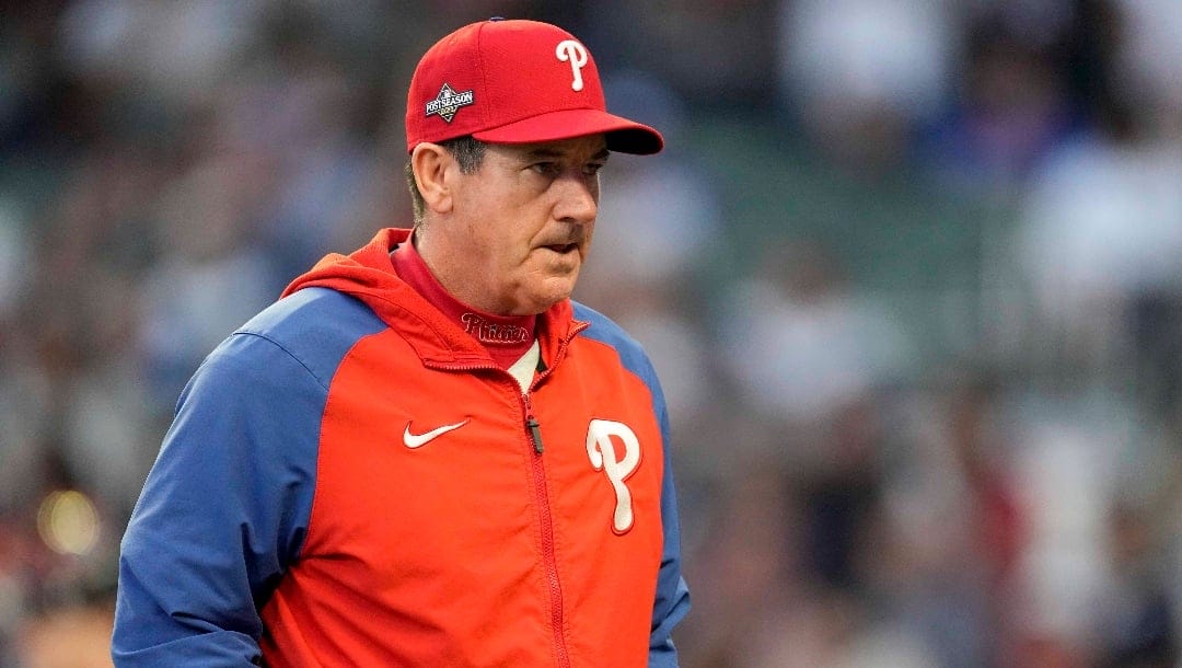 FILE - Philadelphia Phillies Manager Rob Thomson walks to the mound during the fourth inning of Game 1 of a baseball NL Division Series against Atlanta Braves, Oct. 7, 2023, in Atlanta. The Phillies announced Monday, Dec. 4, 2023, that they have extended Thomson's contract through the 2025 season after he led the team to two straight trips to the NL Championship Series. (AP Photo/John Bazemore, File)
