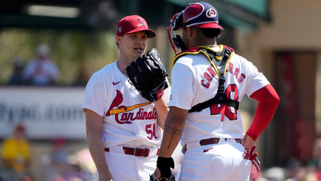 St. Louis Cardinals starting pitcher Sonny Gray (54) talks on the mound with catcher Willson Contreras during the first inning of a spring training baseball game against the Boston Red Sox Tuesday, Feb. 27, 2024, in Jupiter, Fla.
