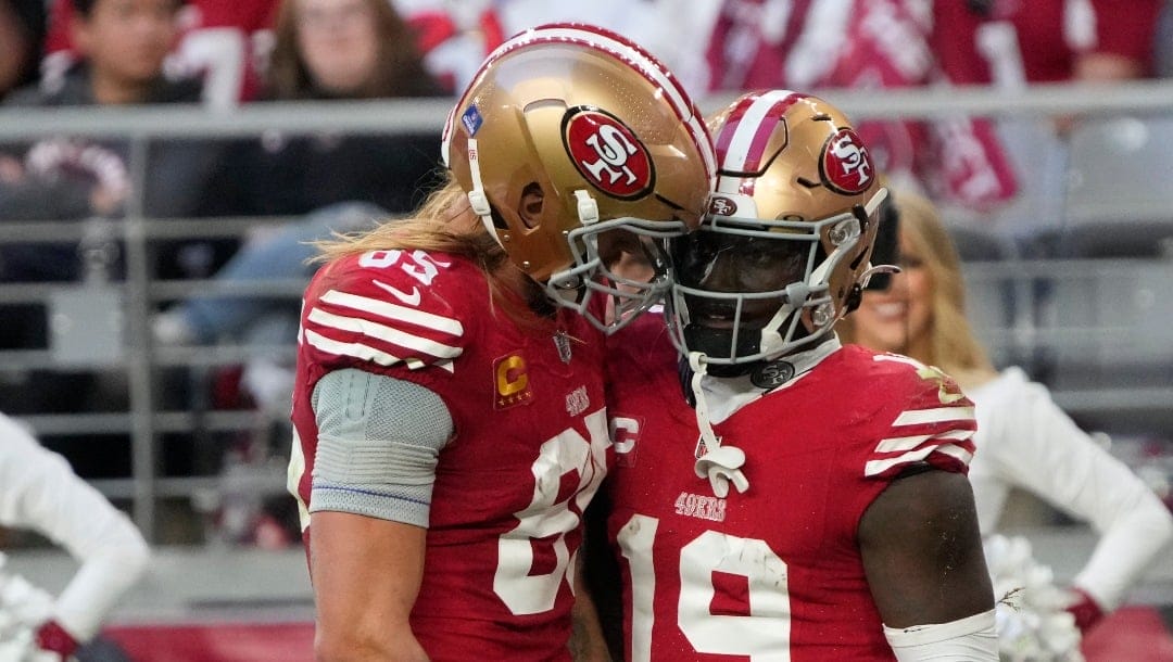 San Francisco 49ers tight end George Kittle (85) and wide receiver Deebo Samuel (19) against the Arizona Cardinals during the first half of an NFL football game, Sunday, Dec. 17, 2023, in Glendale, Ariz. (AP Photo/Rick Scuteri)