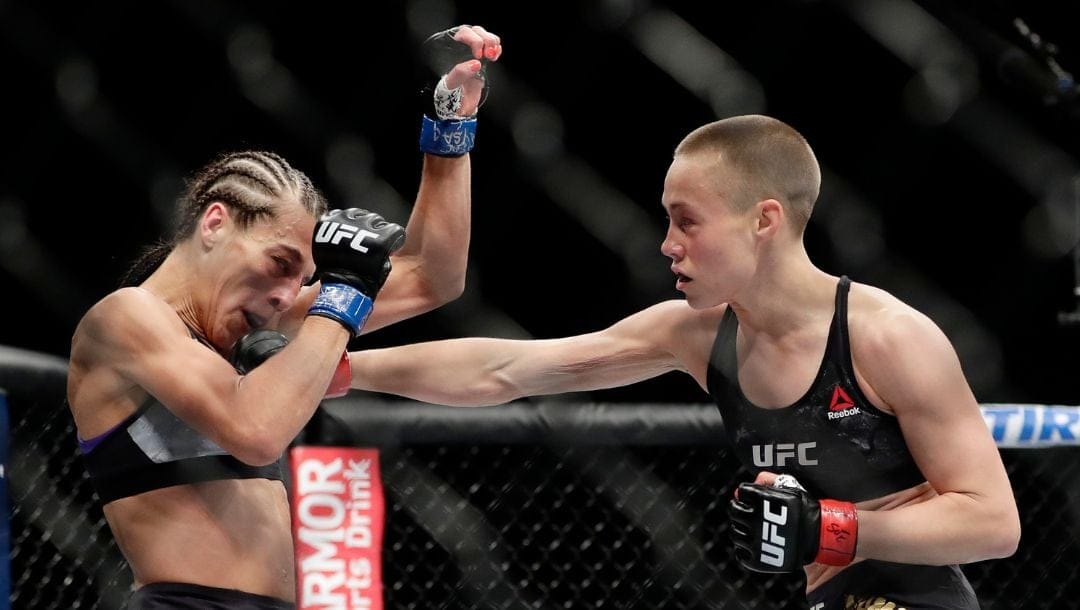 Rose Namajunas, right, punches Poland's Joanna Jedrzejczyk during the first round of a women's strawweight title bout at UFC 223.