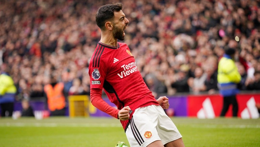 Manchester United's Bruno Fernandes, celebrates after scoring the opening goal with a penalty kick during an English Premier League soccer match between Manchester United and Everton at the Old Trafford stadium in Manchester, England, Saturday, March 9, 2024.