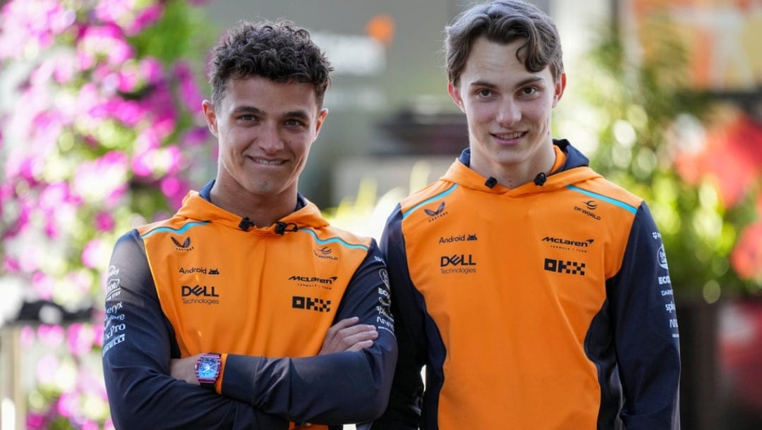 McLaren driver's Lando Norris, left, of Britain and Oscar Piastri of Australia react ahead of the Australian Formula One Grand Prix at Albert Park, Melbourne, Australia, Thursday, March 21, 2024.