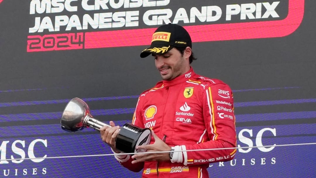 Third place Ferrari driver Carlos Sainz of Spain holds his trophy on the podium after the Japanese Formula One Grand Prix at the Suzuka Circuit in Suzuka, central Japan, Sunday, April 7, 2024.