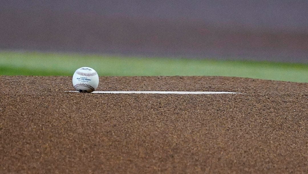 A baseball sits on the pitchers mound before the first inning of a baseball game against the San Francisco Giants, Saturday Sept. 24, 2022, in Phoenix.