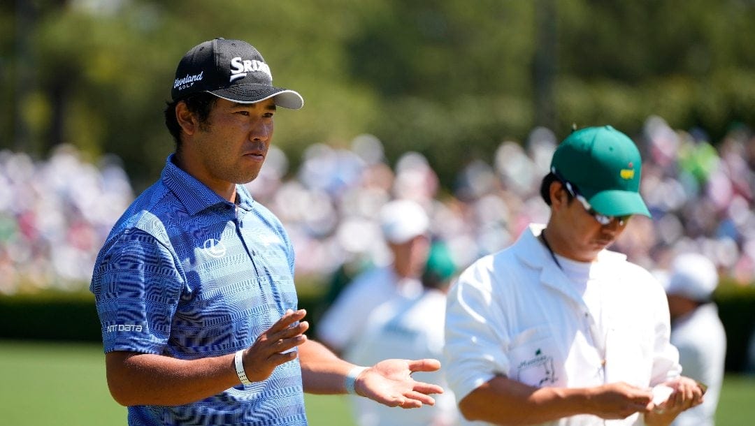 Hideki Matsuyama, of Japan, waits on the driving range during a practice round in preparation for the Masters golf tournament at Augusta National Golf Club Monday, April 8, 2024, in Augusta, Ga.