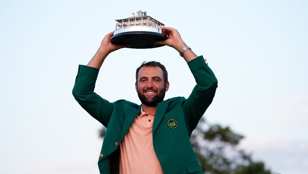 Scottie Scheffler holds the trophy after winning the Masters golf tournament at Augusta National Golf Club Sunday, April 14, 2024, in Augusta, Ga.