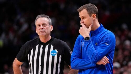 NCAA Referee Doug Sirmons, left, stands next to Duke head coach Jon Scheyer during the first half of an Elite Eight college basketball game against North Carolina State in the NCAA Tournament in Dallas, Sunday, March 31, 2024. (AP Photo/Tony Gutierrez)