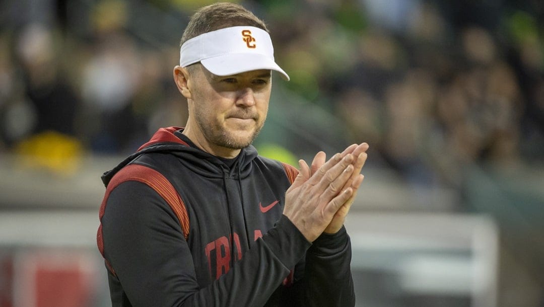 Southern California head coach Lincoln Riley watches his team warm up before the matchup with Oregon in an NCAA college football game Saturday, Nov. 11, 2023, in Eugene, Ore.