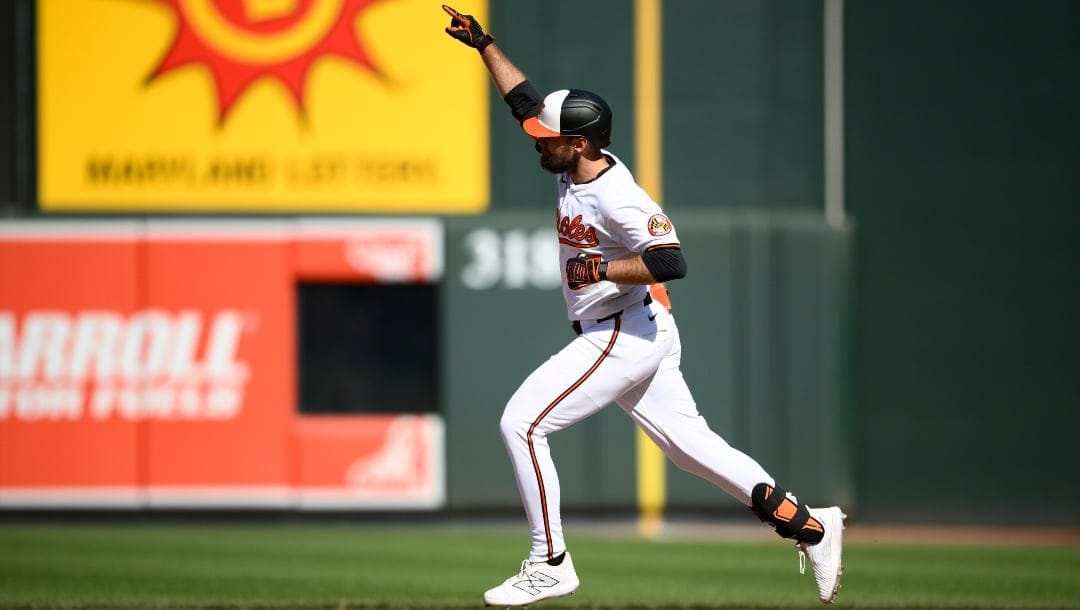 Baltimore Orioles' Colton Cowser celebrates his home run as he rounds the bases during the eighth inning of a baseball game against the Milwaukee Brewers, Sunday, April 14, 2024, in Baltimore.