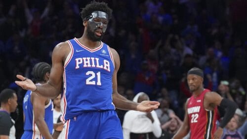 Joel Embiid #21 of the Philadelphia 76ers reacts in front of Jimmy Butler #22 of the Miami Heat after making a basket and getting fouled in the second half during Game Three of the 2022 NBA Playoffs Eastern Conference Semifinals at the Wells Fargo Center on May 6, 2022 in Philadelphia, Pennsylvania. The 76ers defeated the Heat 99-79.