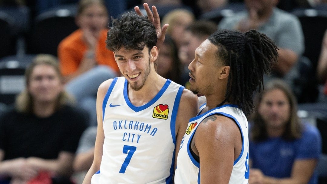 Jalen Williams #8 of the Oklahoma City Thunder congratulates teammate Chet Holmgren #7 after he scored against the Utah Jazz during the first half of their NBA Summer League game July 3, 2023 at the Delta Center in Salt Lake City, Utah.