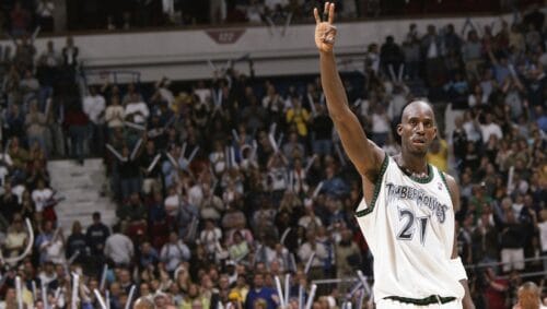 Kevin Garnett #21 of the Minnesota Timberwolves holds up three fingers after winning the game against the Sacramento Kings in Game five of the Western Conference Semifinals during the 2004 NBA Playoffs at Target Center on May 14, 2004 in Minneapolis, Minnesota.