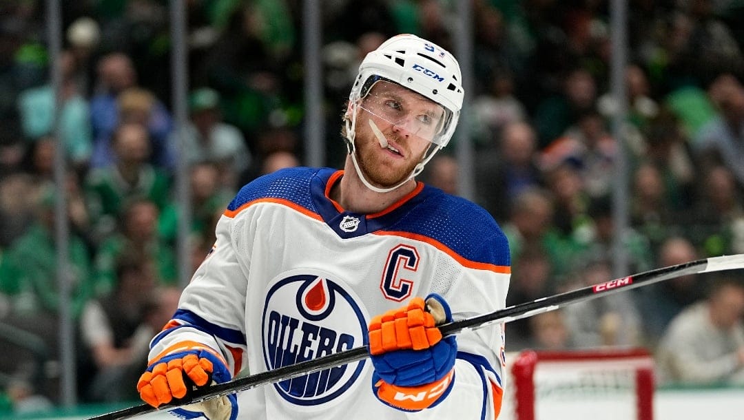 Edmonton Oilers' Connor McDavid waits ona face off during an NHL hockey game against the Dallas Stars, Wednesday, April 3, 2024, in Dallas. (AP Photo/Tony Gutierrez)