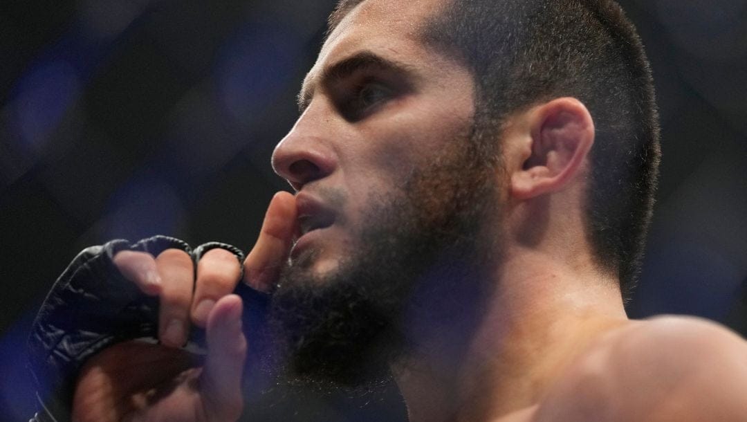 Islam Makhachev of Russia celebrates after he beats Alex Volkanovski of Australia in the UFC lightweight championship fight.