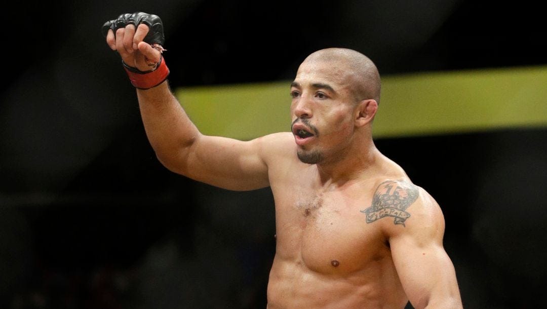 Jose Aldo celebrates after defeating Frankie Edgar during their featherweight championship mixed martial arts bout at UFC 200.
