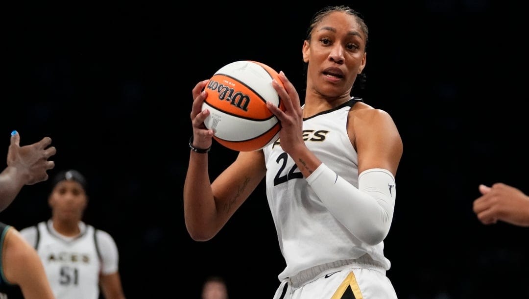 Las Vegas Aces' A'ja Wilson (22) looks to pass during the second half in Game 4 of a WNBA basketball final playoff series against the New York Liberty, Wednesday, Oct. 18, 2023, in New York.
