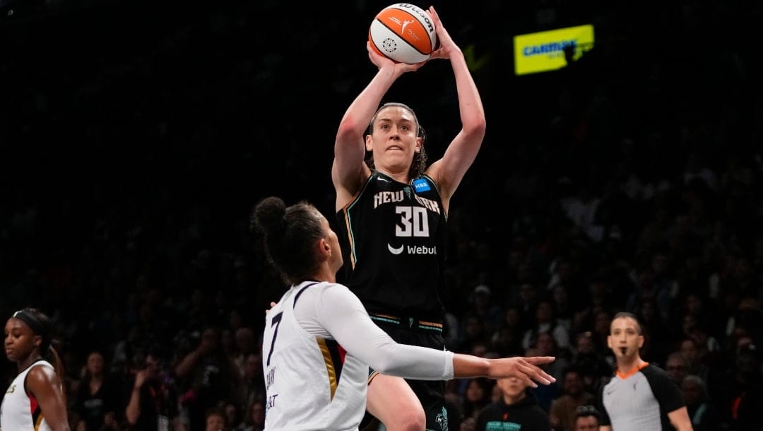 New York Liberty's Breanna Stewart (30) shoots over Las Vegas Aces' Kelsey Plum (7) during the second half in Game 3 of a WNBA basketball final playoff series Oct. 15, 2023, in New York. Reigning WNBA MVP Stewart re-signed with the Liberty, the team announced Monday, Feb. 26, 2024.