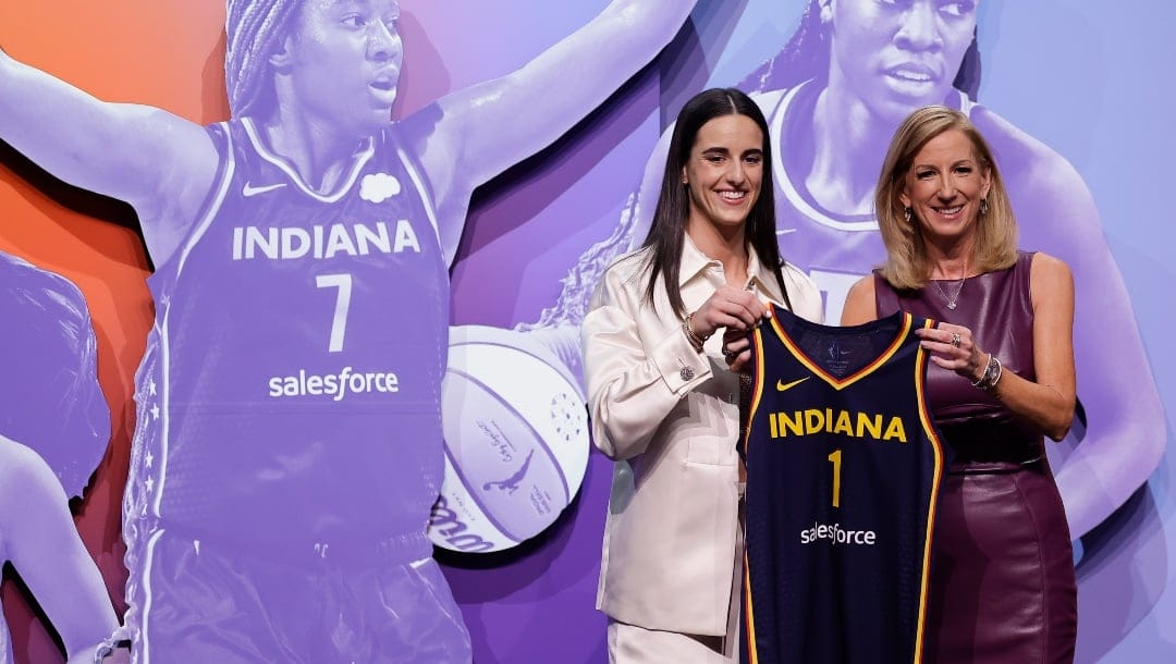 Iowa's Caitlin Clark, left, poses for a photo with WNBA commissioner Cathy Engelbert, right, after being selected first overall by the Indiana Fever during the first round of the WNBA basketball draft, Monday, April 15, 2024, in New York.