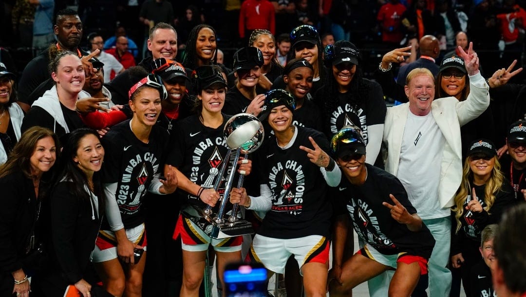 The Las Vegas Aces celebrate with the trophy after Game 4 of a WNBA basketball final playoff series against the New York Liberty Wednesday, Oct. 18, 2023, in New York. The Aces won 70-69.