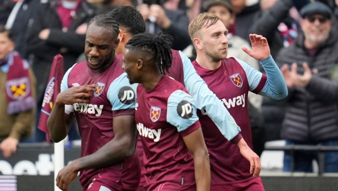 West Ham's Jarrod Bowen, right, celebrates with teammates after scoring his side's opening goal during the English Premier League soccer match between West Ham United and Liverpool at London stadium in London, Saturday, April 27, 2024.