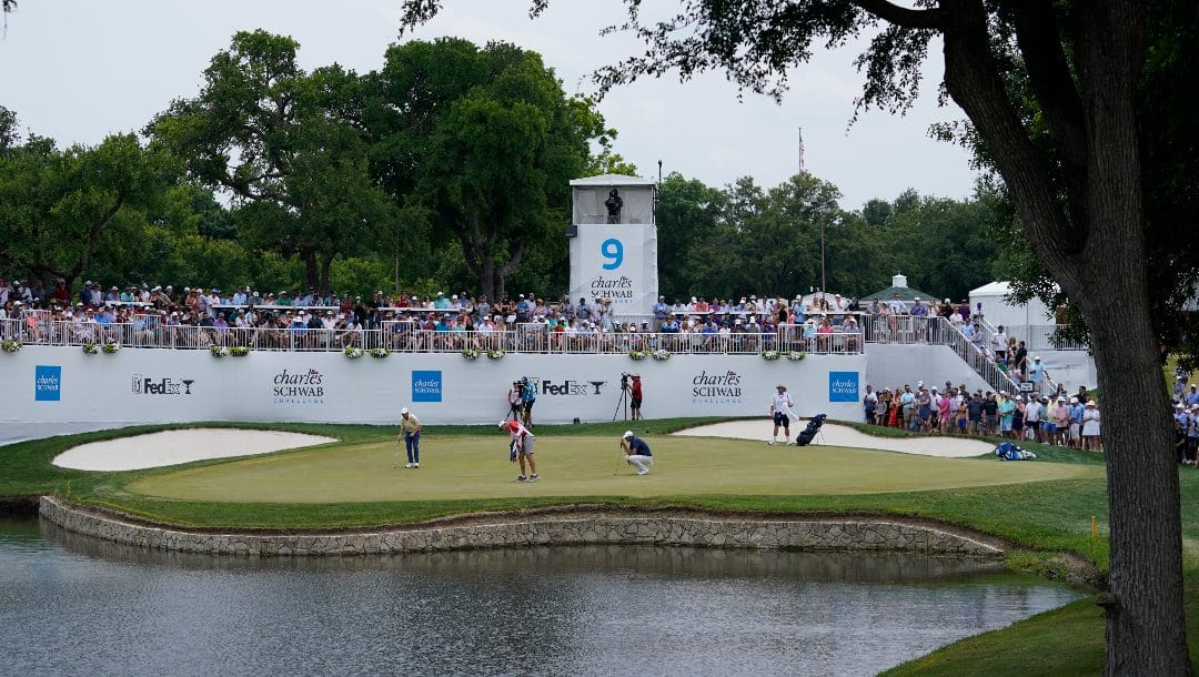 The group including Scottie Scheffler and Paul Haley play the ninth hole during the final round of the Charles Schwab Challenge golf tournament at Colonial Country Club in Fort Worth, Texas, Sunday, May 28, 2023.