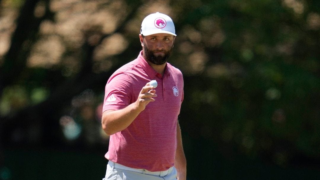 Jon Rahm, of Spain, waves after making a putt on the third hole during final round at the Masters golf tournament at Augusta National Golf Club Sunday, April 14, 2024, in Augusta, Ga.