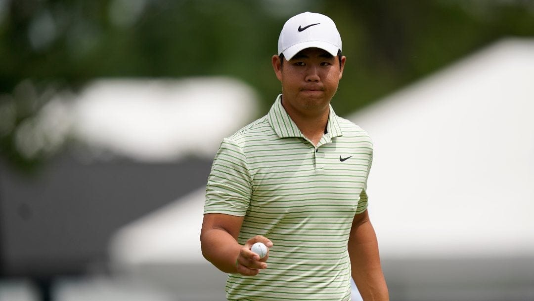 Tom Kim, of South Korea, gestures after making a putt on the 10th hole during the second round of the Wells Fargo Championship golf tournament at Quail Hollow Friday, May 10, 2024, in Charlotte, N.C.