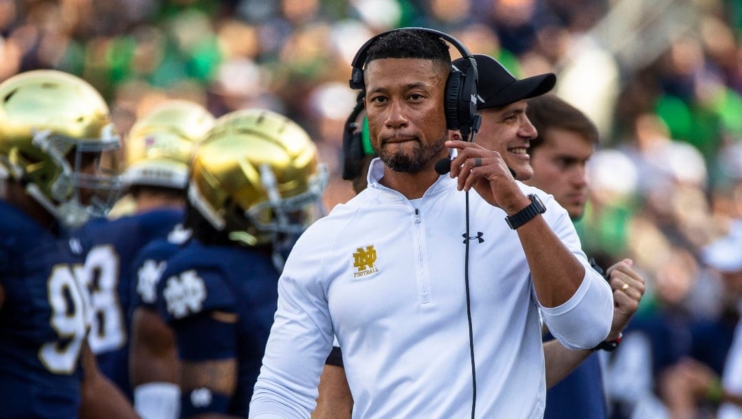 Notre Dame head coach Marcus Freeman walks the sideline during the second half of an NCAA college football game against Tennessee State on Saturday, Sept. 2, 2023, in South Bend, Ind. (AP Photo/Michael Caterina)