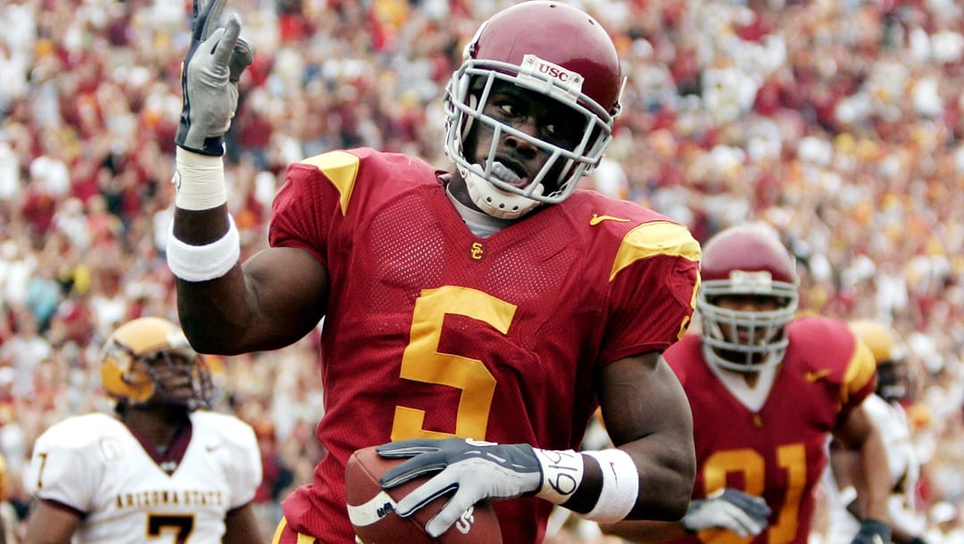 Southern Cal's Reggie Bush celebrates after scoring a touchdown against Arizona State during the first quarter of their PAC 10 football game Saturday, Oct. 16, 2004, at the Coliseum in Los Angeles.