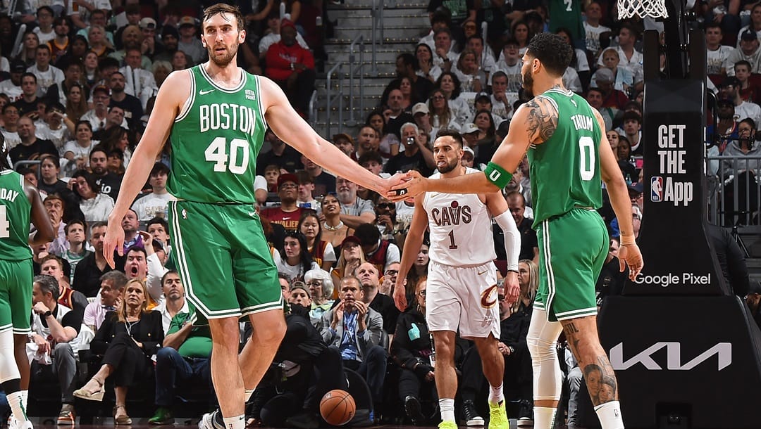 CLEVELAND, OH - MAY 13: Luke Kornet #40 and Jayson Tatum #0 of the Boston Celtics high five during the game against the Cleveland Cavaliers during Round 2 Game 4 of the 2024 NBA Playoffs on May 13, 2024 at Rocket Mortgage FieldHouse in Cleveland, Ohio.