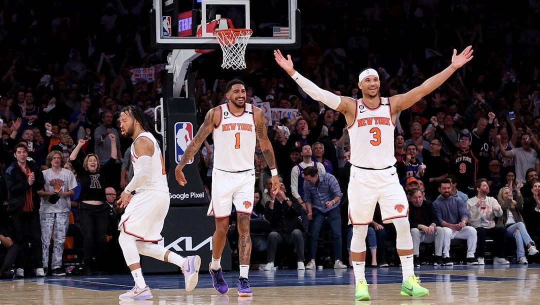 Josh Hart #3 of the New York Knicks celebrates his shot with teammates Jalen Brunson #11 and Obi Toppin #1 in the fourth quarter against the Cleveland Cavaliers during Game Four of the Eastern Conference First Round Playoffs at Madison Square Garden on April 23, 2023 in New York City. The New York Knicks defeated the Cleveland Cavaliers 102-93.