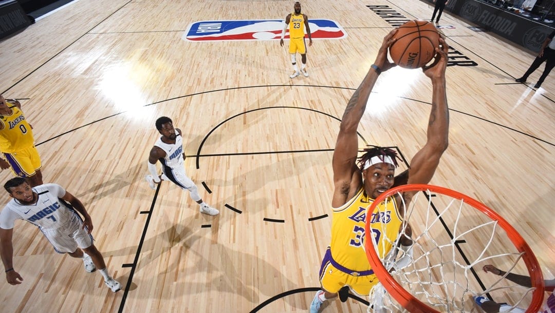 Orlando, FL - JULY 25: Dwight Howard #39 of the Los Angeles Lakers dunks the ball against the Orlando Magic during a scrimmage on July 25, 2020 at HP Field House at ESPN Wide World of Sports in Orlando, Florida.