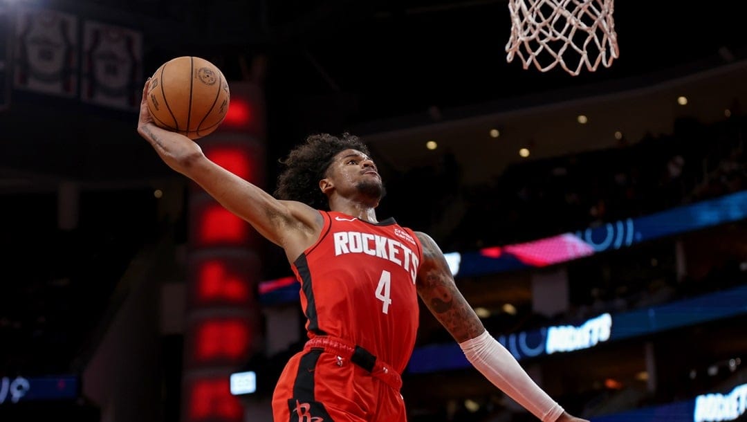 HOUSTON, TEXAS - MARCH 25: Jalen Green #4 of the Houston Rockets dunks the ball in the second half against the Portland Trail Blazers at Toyota Center on March 25, 2024 in Houston, Texas.