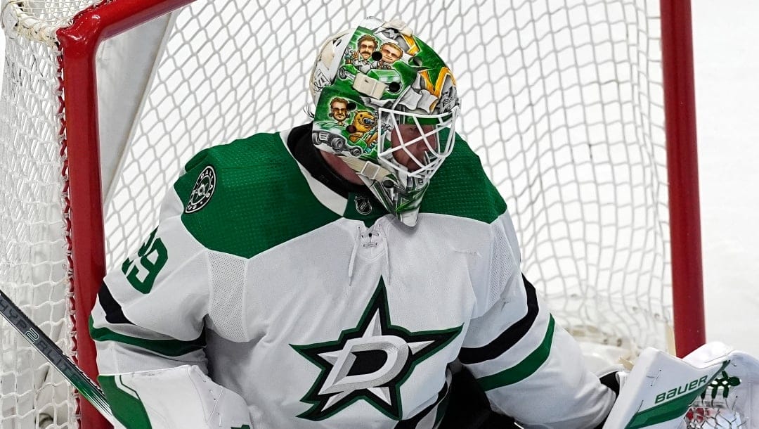 Dallas Stars goaltender Jake Oettinger makes a pad save in the third period of Game 4 of an NHL hockey Stanley Cup playoff series against the Colorado Avalanche, Monday, May 13, 2024, in Denver. (AP Photo/David Zalubowski)
