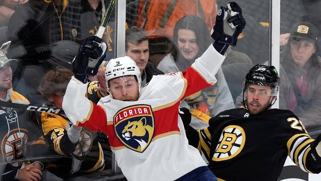 Florida Panthers' Sam Bennett (9) checks Boston Bruins' Parker Wotherspoon (29) during the first period in Game 4 of an NHL hockey Stanley Cup second-round playoff series, Sunday, May 12, 2024, in Boston. (AP Photo/Michael Dwyer)