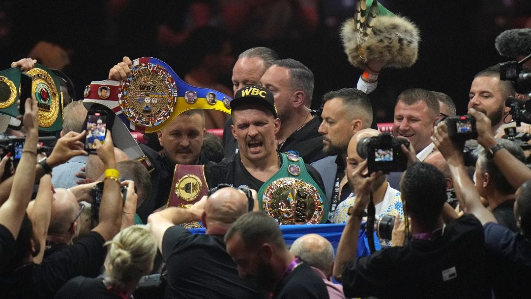 Ukraine's Oleksandr Usyk celebrates after beating Britain's Tyson Fury in their undisputed heavyweight world championship.