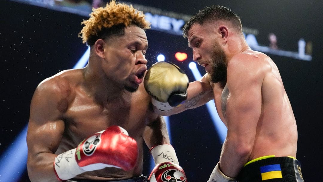 Devin Haney, left, fights Vasiliy Lomachenko in an undisputed lightweight championship boxing match Saturday, May 20, 2023.