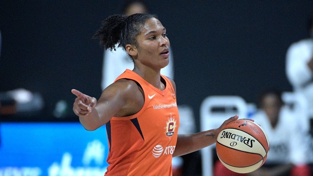 Connecticut Sun forward Alyssa Thomas (25) brings the ball up the court during the second half of Game 1 of a WNBA basketball semifinal round playoff game against the Las Vegas Aces, Sunday, Sept. 20, 2020, in Bradenton, Fla.