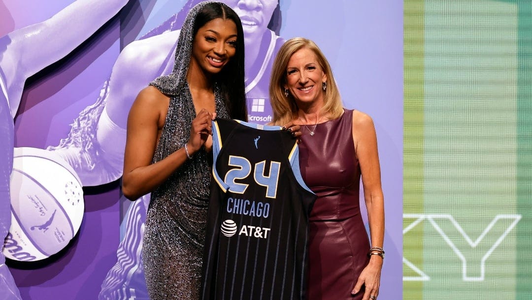 LSU's Angel Reese, left, poses for a photo with WNBA commissioner Cathy Engelbert after being selected seventh overall by the Chicago Sky during the first round of the WNBA basketball draft on Monday, April 15, 2024, in New York.