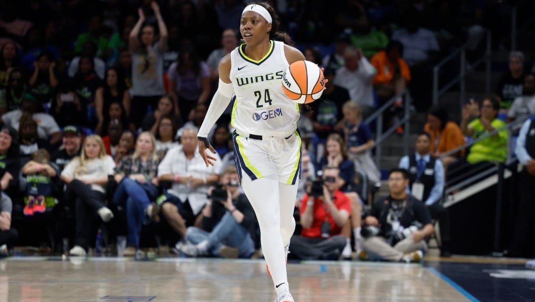 Dallas Wings guard Arike Ogunbowale (24) moves upcourt against the Indiana Fever during the second half of an WNBA basketball game in Arlington, Texas, Friday, May 3, 2024.