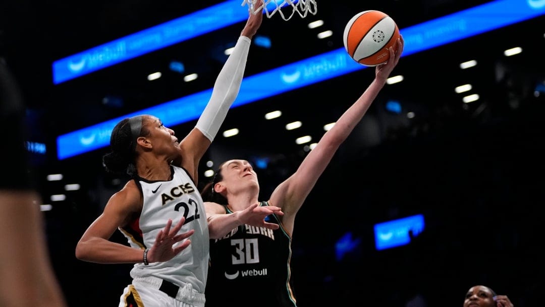 New York Liberty's Breanna Stewart (30) drives past Las Vegas Aces' A'ja Wilson (22) during the second half in Game 3 of a WNBA basketball final playoff series, Sunday, Oct. 15, 2023, in New York.